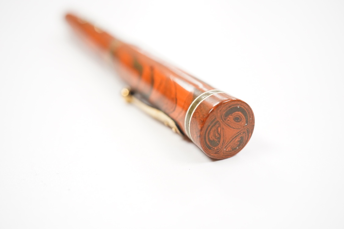 A Waterman Red Ripple No. 5 lever filler with green cap band and fitted with No. 5 Waterman nib